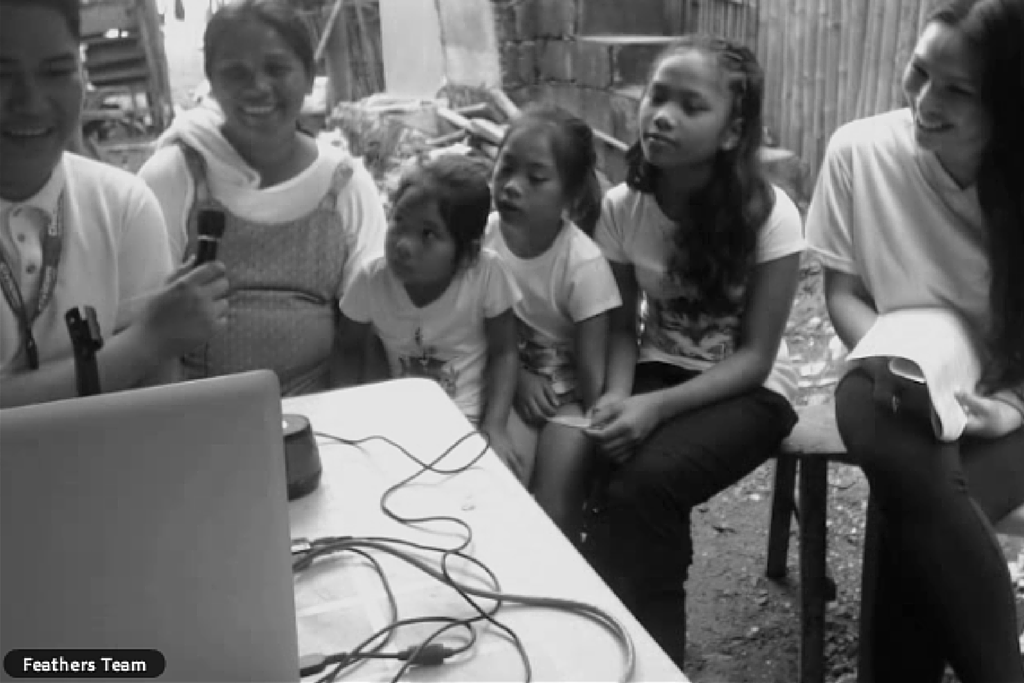 Image of a Feathers Ceremony. It's a virtual or in-person meeting with your sponsored family that allows you and your family to learn more about them and their situation.